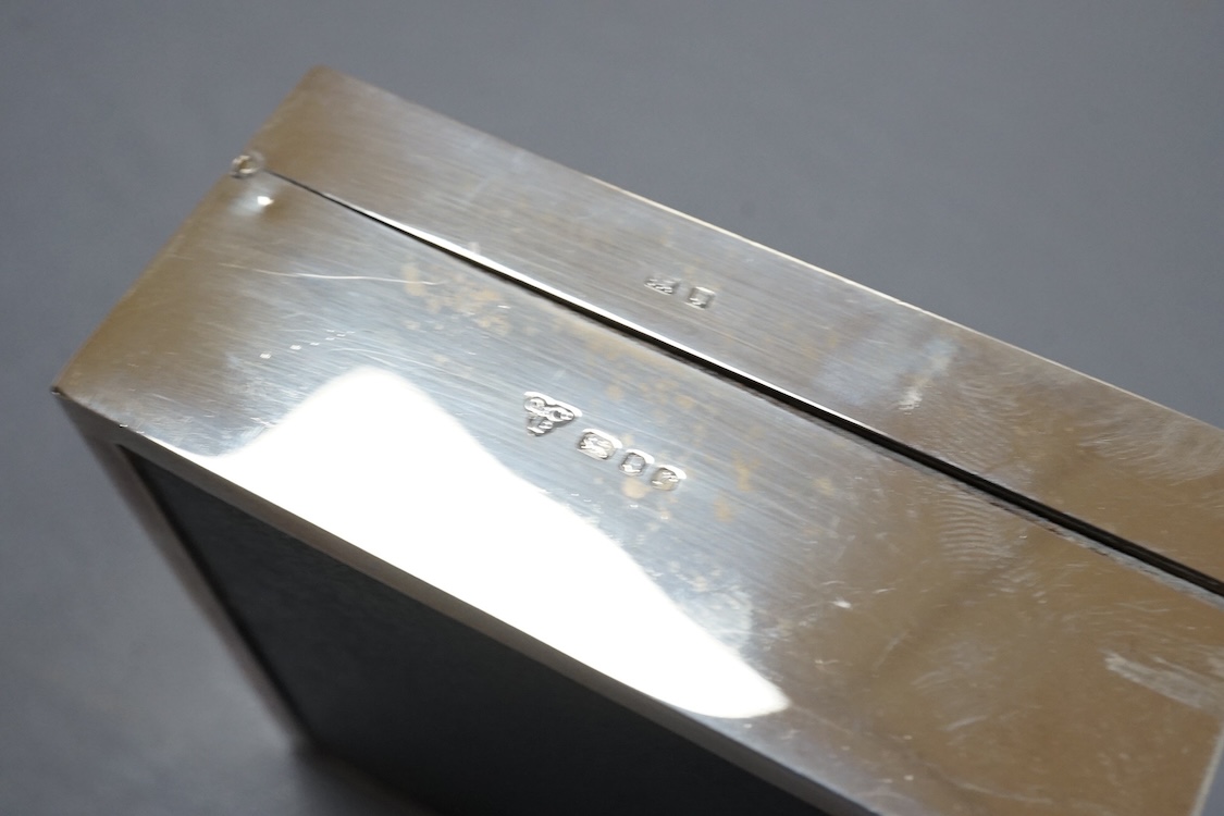 Three assorted silver mounted cigarette boxes, the largest by Frederick William Hentsch, London, 1924, 14.3cm.